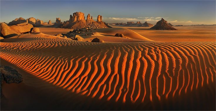 sahara sand dunes in algeria photo by yury pustovoy